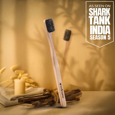 Edinora soft toothbrush with clove infused neem wood handle - tapered, charcoal infused bristles